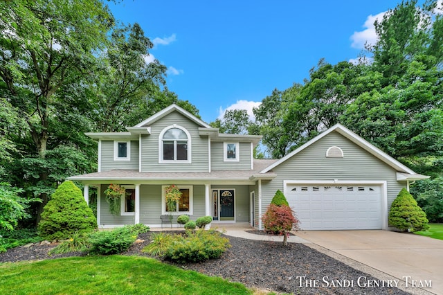 view of front property featuring a porch and a garage