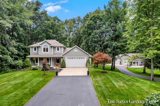 front of property with a front yard and a garage