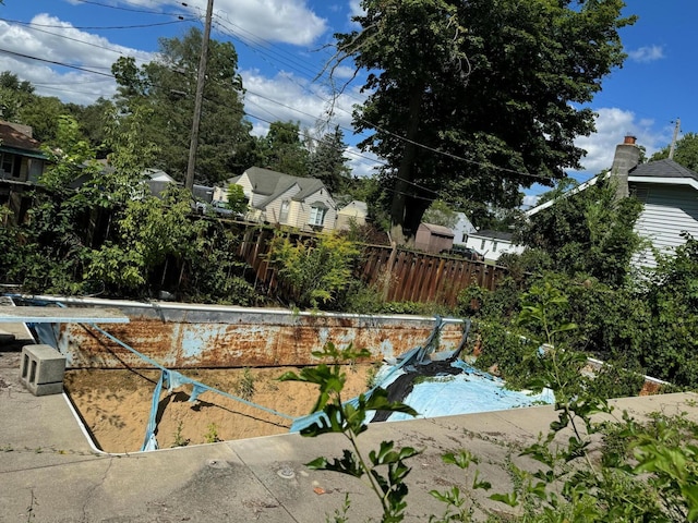 view of swimming pool with fence