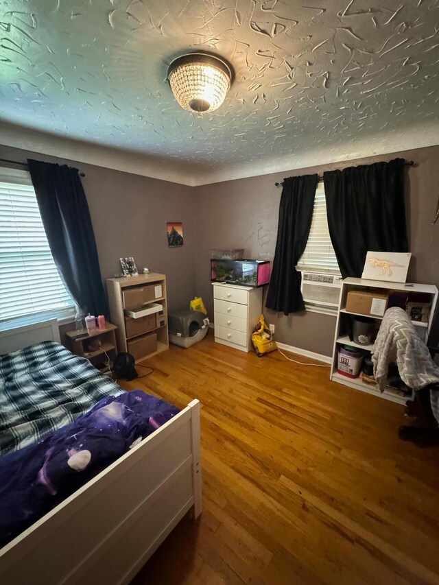 bedroom featuring wood-type flooring