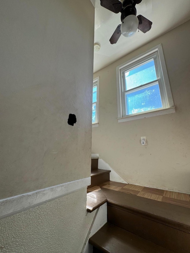 stairs with ceiling fan