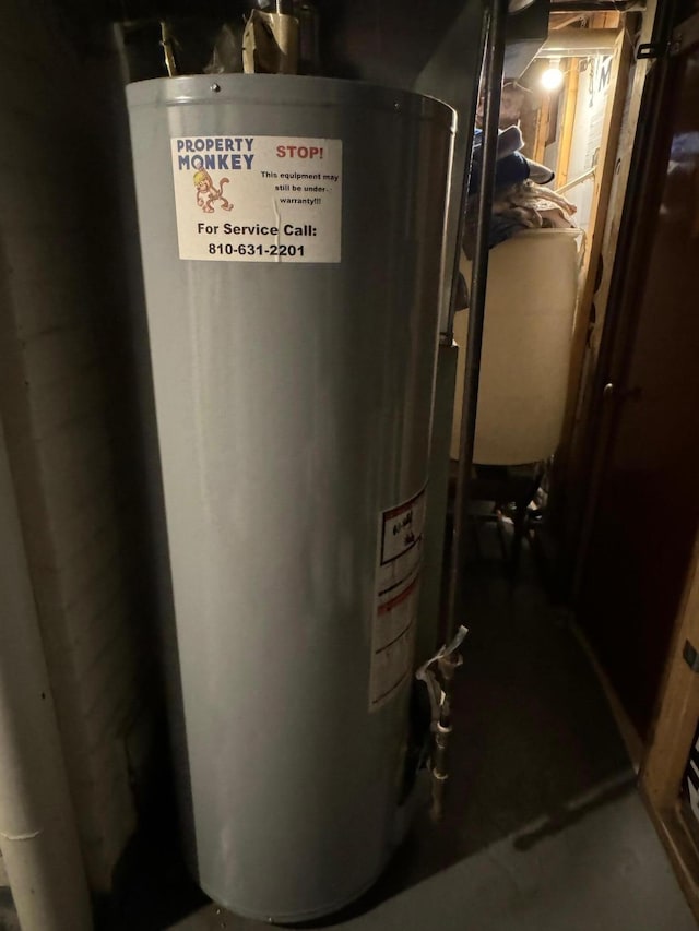 utility room featuring gas water heater