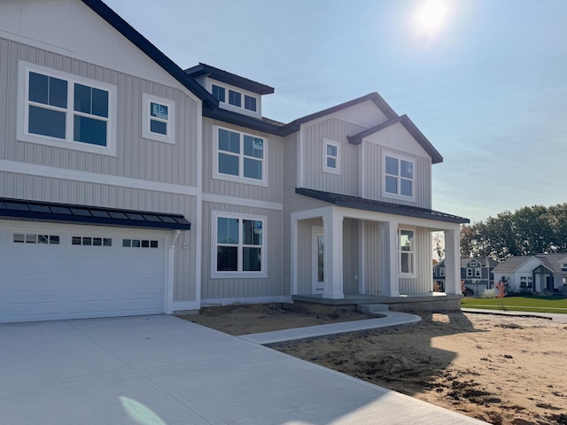 view of front of house with a garage and covered porch