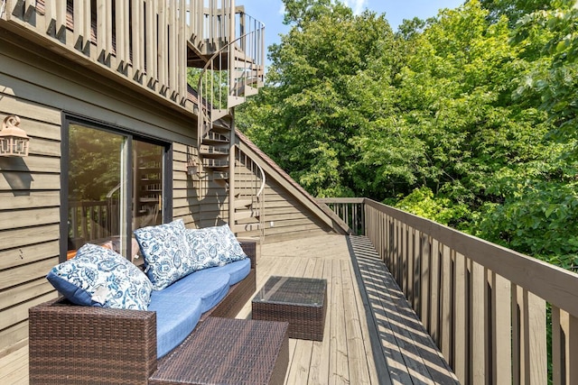 deck featuring outdoor lounge area and stairs