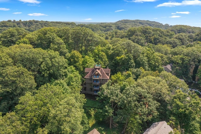 drone / aerial view featuring a view of trees