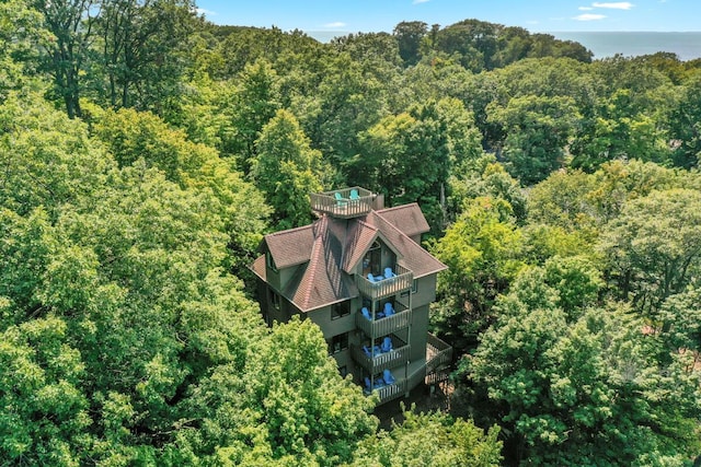 drone / aerial view featuring a forest view