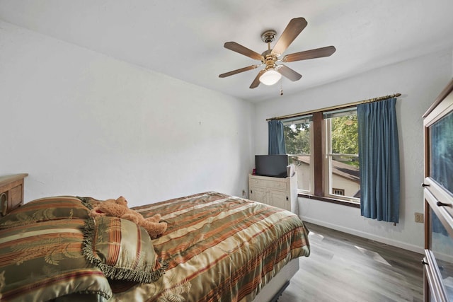 bedroom featuring ceiling fan and wood-type flooring