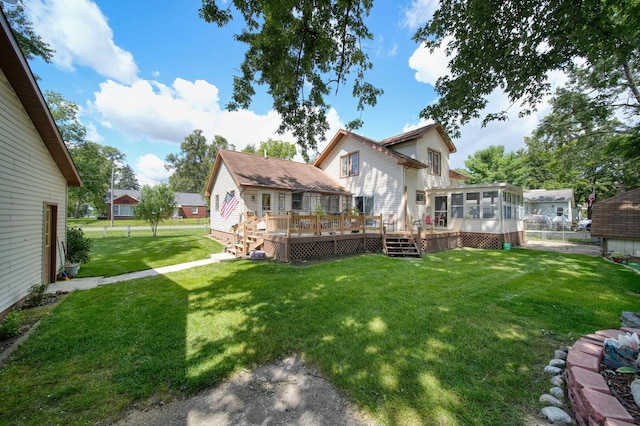 view of yard with a sunroom and a deck