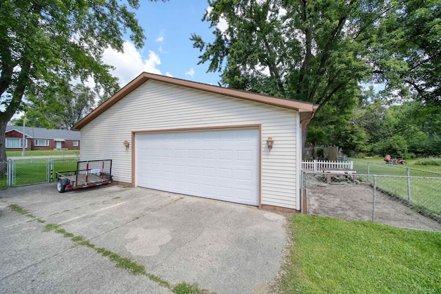 garage featuring a yard