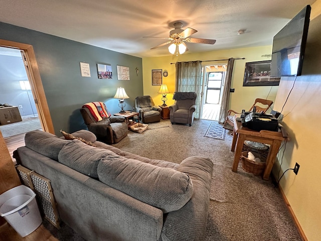 living room featuring ceiling fan and carpet flooring