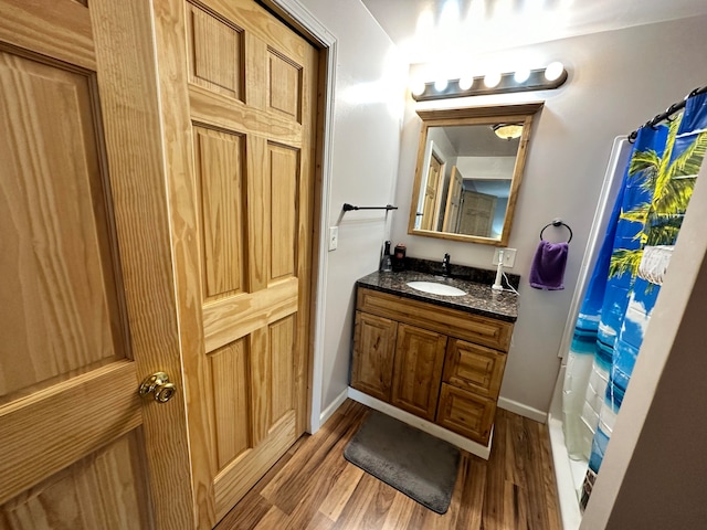 bathroom with vanity and hardwood / wood-style floors