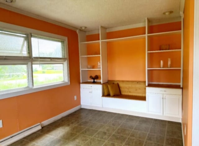 interior space with ornamental molding, baseboards, and a baseboard radiator