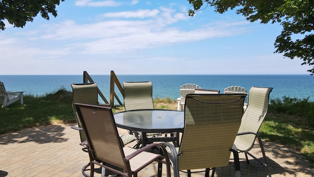 view of patio with a water view