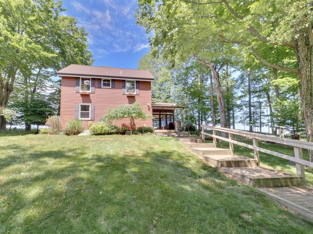 back of house featuring a yard