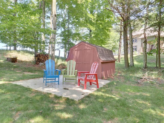 view of yard with a shed and a patio