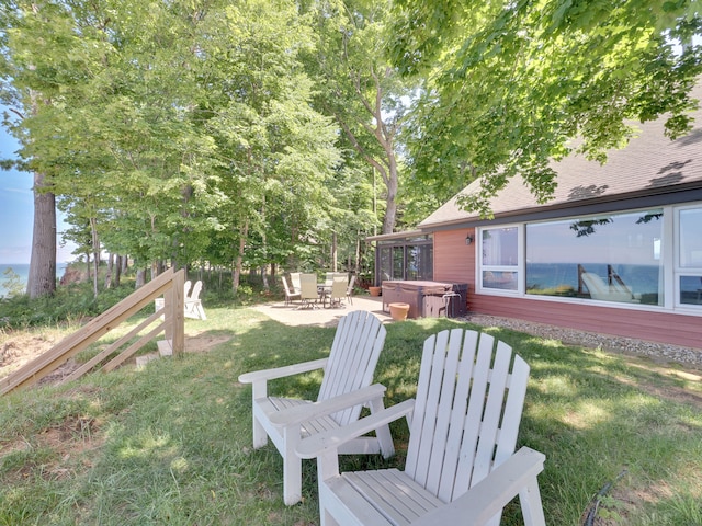 view of yard featuring a patio and a hot tub