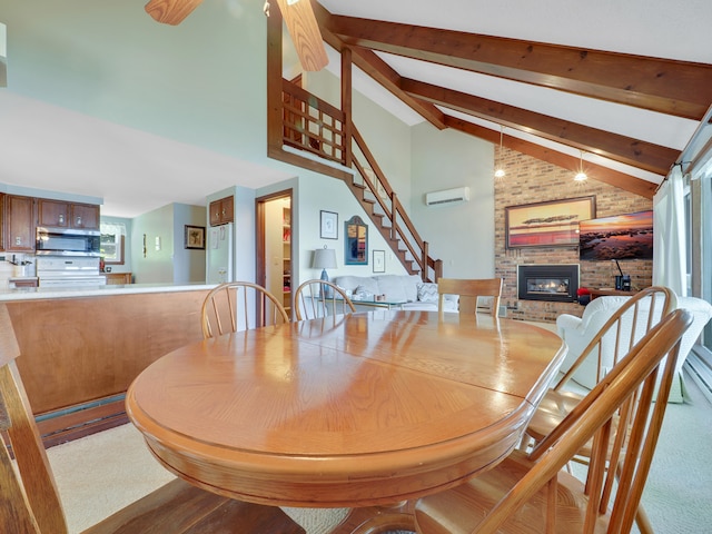 carpeted dining space with brick wall, high vaulted ceiling, beam ceiling, and a brick fireplace