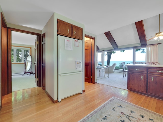 kitchen featuring vaulted ceiling with beams, ceiling fan, light colored carpet, and white fridge