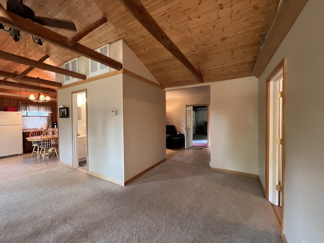 corridor with an inviting chandelier, light colored carpet, wooden ceiling, and beamed ceiling