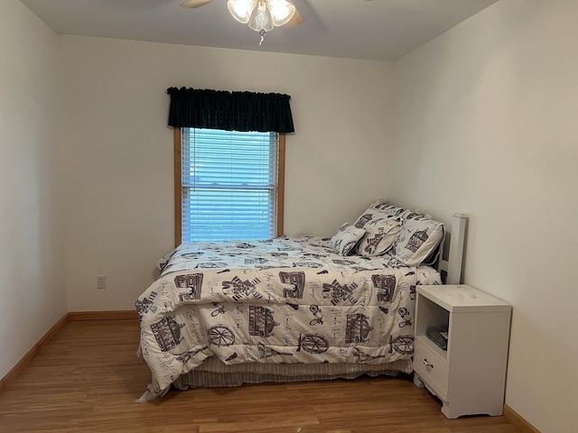 bedroom featuring ceiling fan and light wood-type flooring