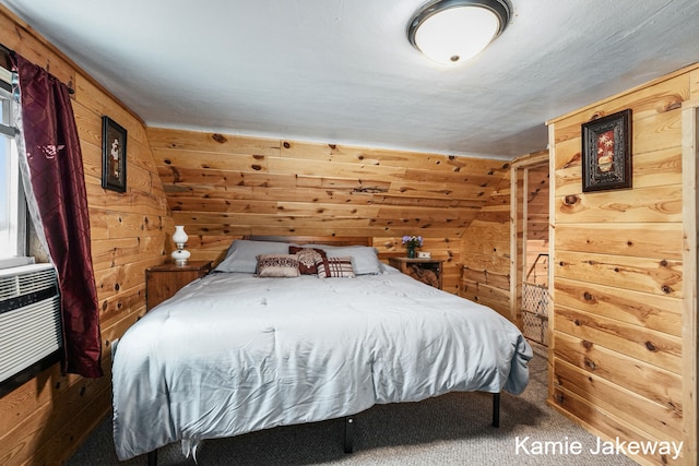 carpeted bedroom featuring wooden walls