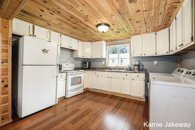 kitchen with white appliances, dark hardwood / wood-style floors, washer and clothes dryer, wood ceiling, and white cabinets