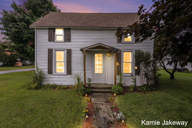 view of front of property with a yard