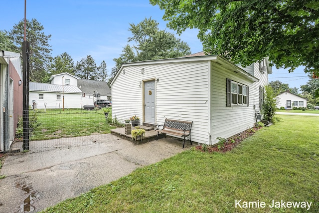 view of outbuilding with a yard