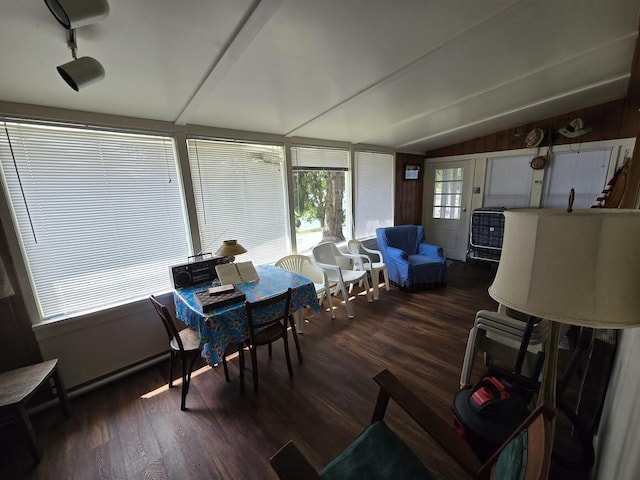 sunroom / solarium featuring lofted ceiling