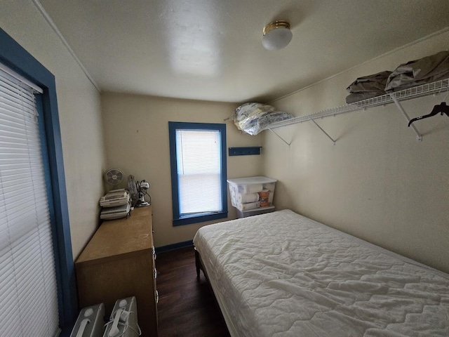 bedroom featuring dark wood-type flooring