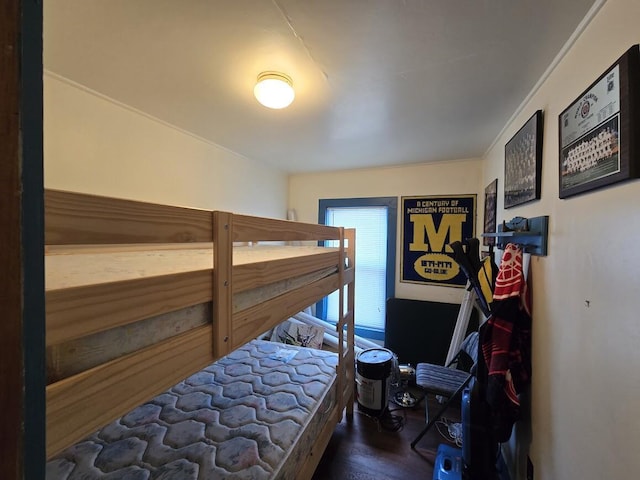 bedroom with dark wood-type flooring