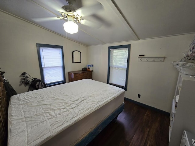 bedroom featuring ceiling fan, dark wood-type flooring, multiple windows, and lofted ceiling