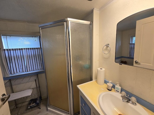 bathroom featuring vanity and a shower with shower door