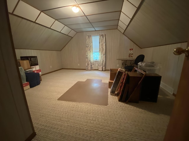 bonus room with lofted ceiling and carpet floors