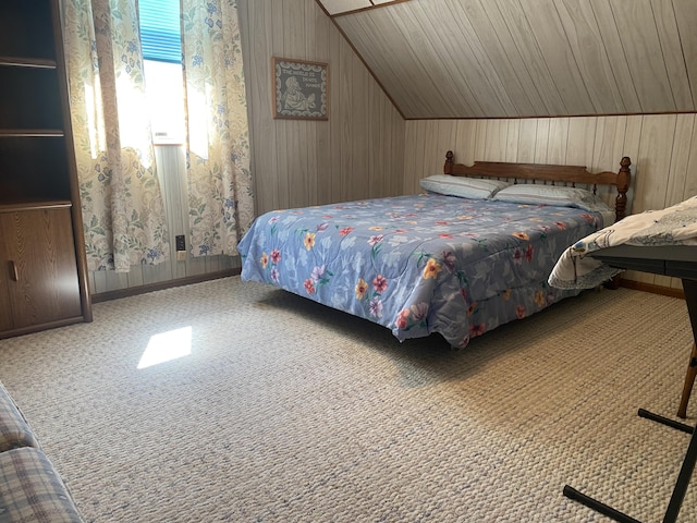 bedroom featuring wood walls, carpet, and vaulted ceiling