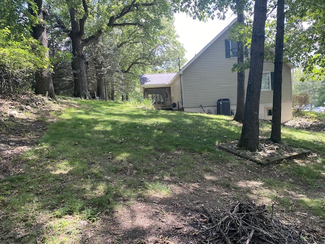 view of yard featuring central air condition unit