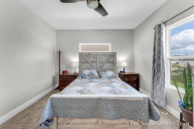 carpeted bedroom with ceiling fan