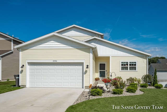 ranch-style house with concrete driveway and an attached garage