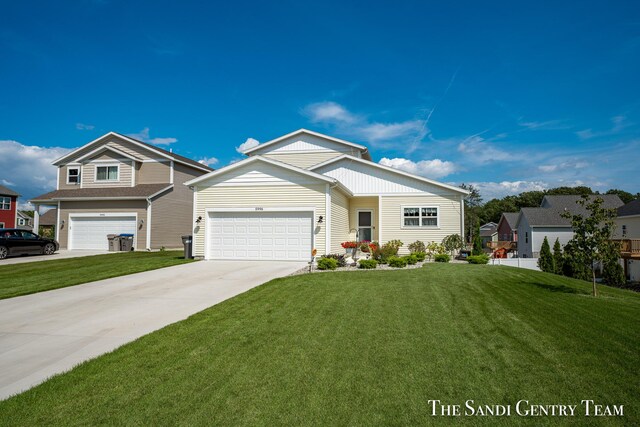 view of front of house featuring a front lawn and a garage