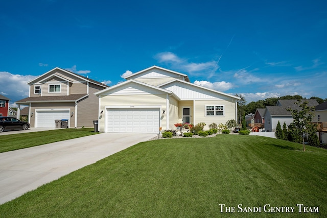 view of front facade with a garage, concrete driveway, and a front yard