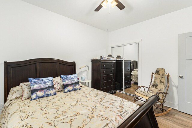 bedroom with ceiling fan and light hardwood / wood-style floors