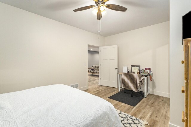 bedroom featuring ceiling fan and light hardwood / wood-style flooring