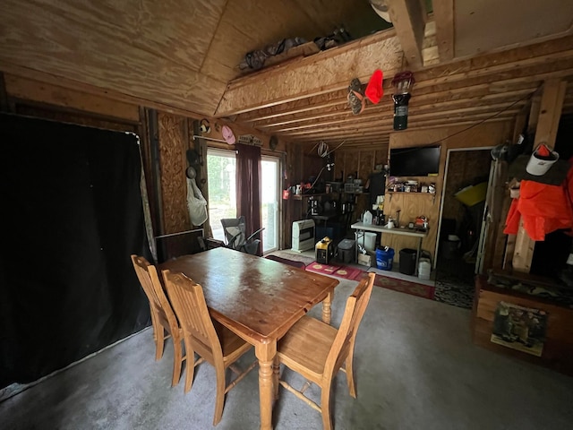 dining area featuring concrete flooring