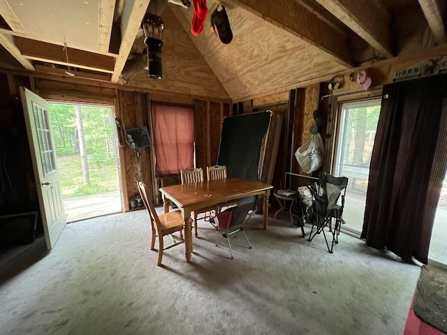 dining room featuring vaulted ceiling and a healthy amount of sunlight