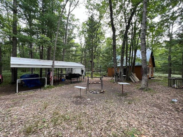 view of yard with a carport