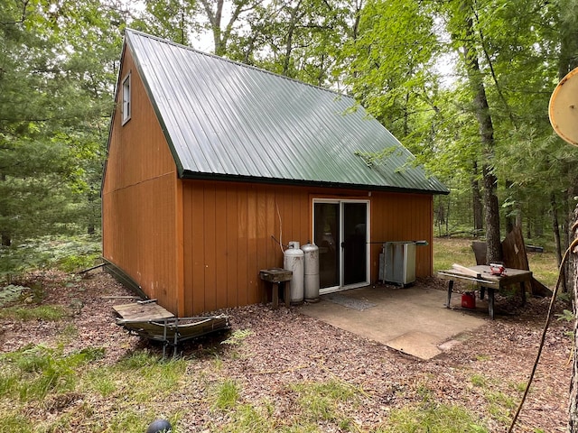 exterior space featuring an outdoor structure and a patio area