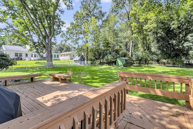 deck with a yard, area for grilling, and a fenced backyard