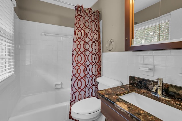 bathroom featuring shower / tub combo with curtain, tile walls, toilet, and vanity