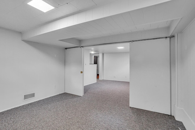 finished basement featuring carpet flooring and visible vents