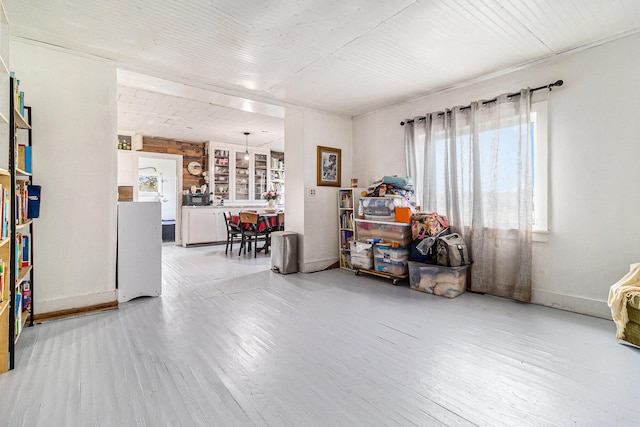 miscellaneous room with wood finished floors and baseboards